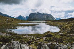 Scenic mountain landscape with a tranquil lake in Vestland, Norway during the summer.